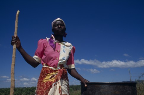 MALAWI, Lipangwe, Farm worker on organic training farm LOMADEF making chicken manure
