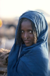 ETHIOPIA, People, Body Decoration, Girl in blue shawl with light facial scarification wearing a