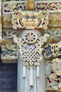 CHINA, Gansu, Xiahe, Detail of carved ornamental Guardians made to protect the Temple