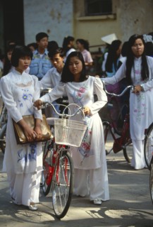 VIETNAM, North, Hanoi, Girls wearing the traditional ao dai outside their college