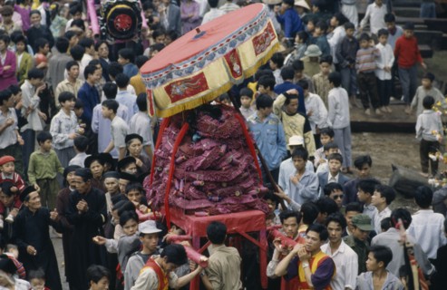 VIETNAM, North, Huge firecracker  being carried through the street at the Firecracker Festival