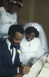 NIGERIA, Religion, Wedding, Ibo wedding ceremony.  Couple in traditional western wedding dress