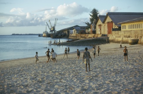 TANZANIA, Zanzibar Island, Boys playing football on the beach.