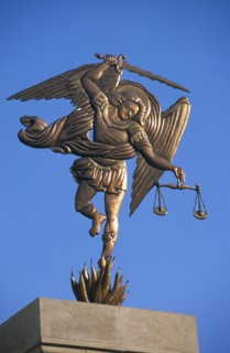 EGYPT, Nile Valley, Aswan, Coptic Cathedral.  Statue of the Archangel Michael holding sword and