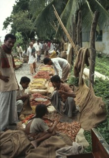 BANGLADESH, General, Food market on pavement with produce in jute bags