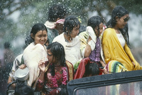 MYANMAR, Mandalay, Thingyan Buddhist Water Festival.  Group of young girls in back of truck