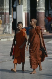 MYANMAR, Yangon, Shwedagon Pagoda.  Two Therevada Buddhist monks.