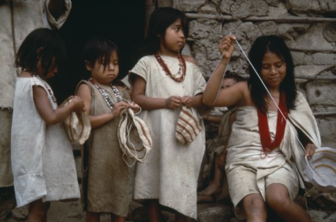 COLOMBIA, People, Kogi, Three young Kogi girls and woman bag making