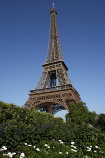 FRANCE, Ile de France, Paris, Angled view of The Eiffel Tower against a blue sky