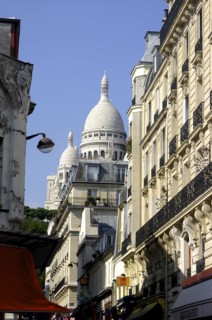 FRANCE, Ile de France, Paris, Sacre Coeur domes seen from a side street