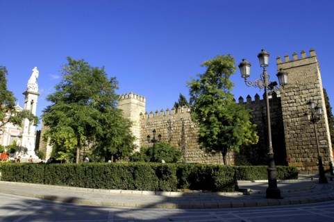 SPAIN, Andalucia, Seville, Crenellated exterior wall of the Royal Alcazar