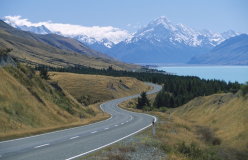 NEW ZEALAND, South Island, Lake Pukaki, View looking north along the lake and road running to Mount