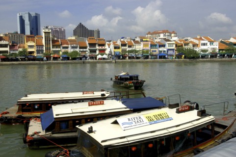 SINGAPORE, General, Three moored boats on Singapore River with city architecture on the opposite