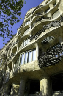 SPAIN, Catalonia, Barcelona, Angled view looking up at Gaudi apartment building Casa Mila
