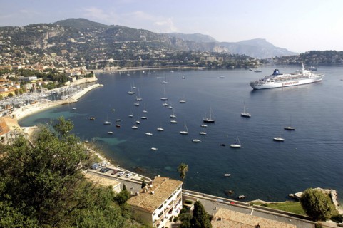 FRANCE, Cote d Azur, View over bay between Nice and Monte Carlo with moored Cruise ship and smaller