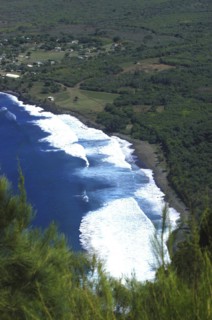 USA, Hawaii, Molokai, Kalaupapa. Aerial view looking down on bay and green coastline