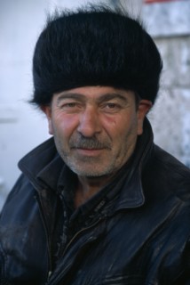 KAZAKHSTAN, Astana, Man in fur hat.  Head and shoulders portrait.