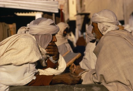 ALGERIA, Markets, Berber traders bargaining.