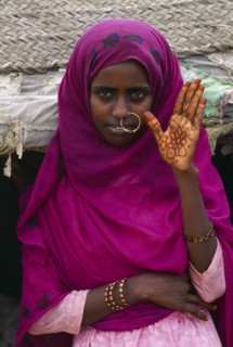 SUDAN, Gadem Gafriet Camp, Beni Amer nomad woman with henna painted hand for marriage.