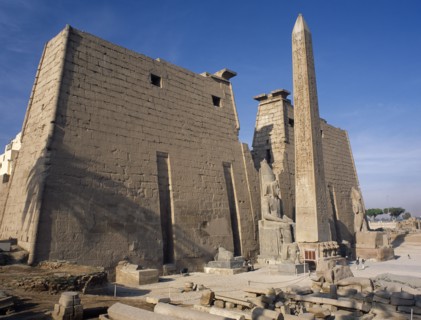 EGYPT, Nile Valley, Luxor, Luxor Temple. Obelisk and statue of Ramses II