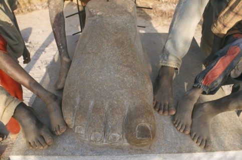 BURKINA FASO, Ougadougou, Boys playing in Managa Sculpture park on the outskirts of Ouga.  Cropped