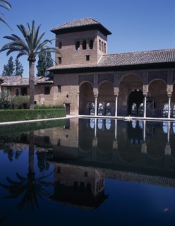 SPAIN, Andalucia, Granada, The Alhambra. Palace of the Maids general view of the tower reflected in