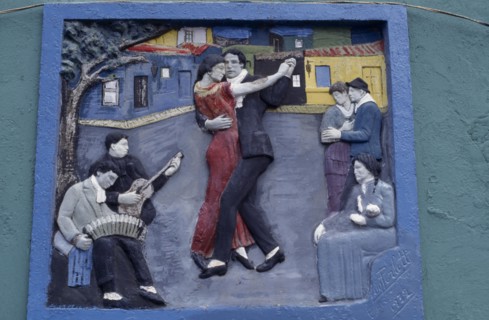 ARGENTINA, Buenos Aires, La Boca.  Painted tableau of tango dancers in the old port district.