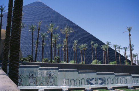 USA, Nevada, Las Vegas, The Luxor Hotel exterior with replica pyramid and hieroglyphics.  Water