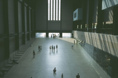 ENGLAND, London, Tate Modern. View over the Old Turbine Hall main entrance with scattering of