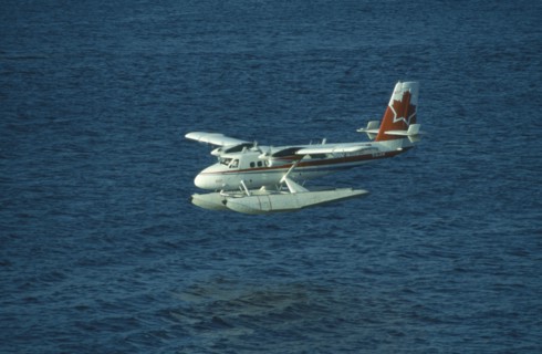 CANADA, British Colombia, Vancouver, Sea plane in Vancouver harbour used as link with isolated