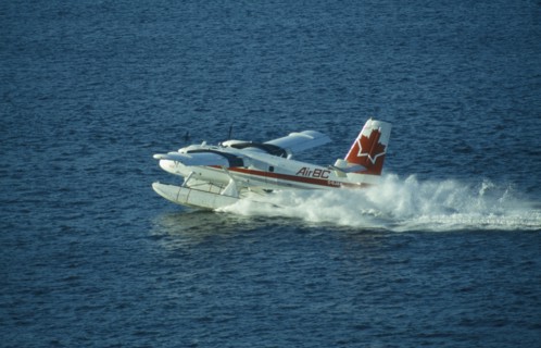 CANADA, British Colombia, Vancouver, Sea plane in Vancouver harbour used as link with isolated