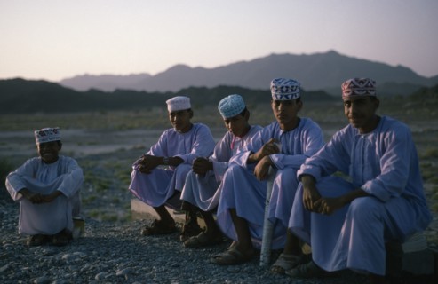 OMAN, Children, "Schoolboys wearing traditional white dishdashas and brimless, embroidered circular