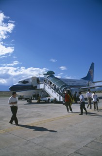 CHINA, Yunnan, Dali, Domestic aircraft on runway with passengers disembarking.