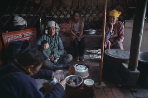 MONGOLIA, People, Mongolian family having meal inside a yurt