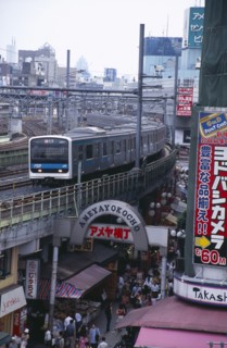 JAPAN, Honshu, Tokyo, View over the busy Ameyayokocho market street and the elevated train tracks
