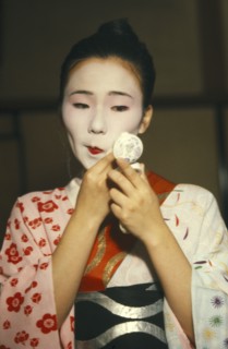 JAPAN, Geisha , Geisha applying white face powder