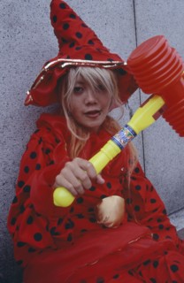 JAPAN, Honshu, Tokyo, Harajuku District. Portrait of young teenage girl wearing a red and black