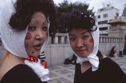 JAPAN, Honshu, Tokyo, Harajuku District. Portrait of two young teenage girls wearing theatrical