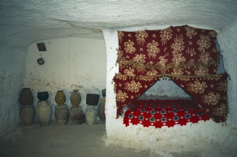 TUNISIA, Zaraoua, "Berber home, interior room cut from rock"