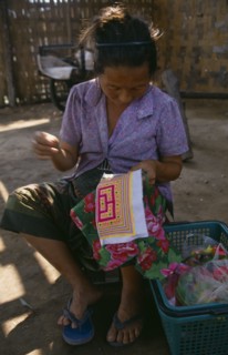 LAOS, Craft, Hmong woman embroidering textile