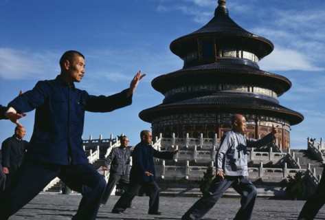 CHINA, Hebei, Beijing, Group of men practising Tai Chi in front of the Temple of Heaven.