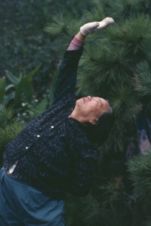 CHINA, Shanghai, Elderly woman doing Tai Chi exercises
