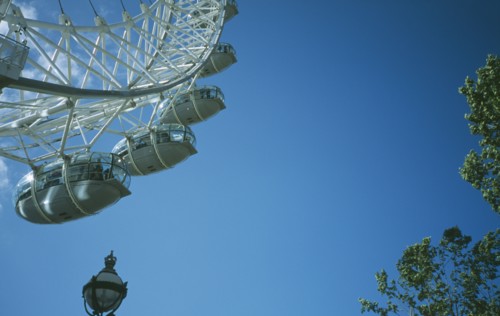 ENGLAND, London, British Airways London Eye Milennium wheel partial view with lamppost in the