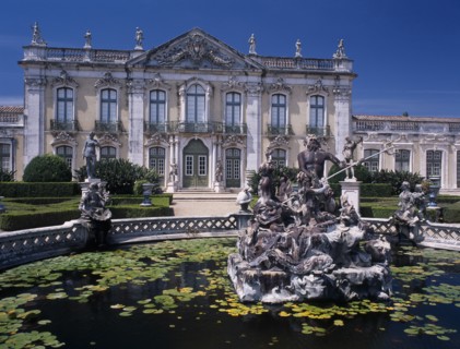 PORTUGAL, Near Lisbon, Palacio Nacional de Queluz facade with pond and central statue in the