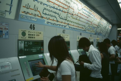 JAPAN, Honshu, Tokyo, Shinjuku. People using Metro or Subway ticket vending machines