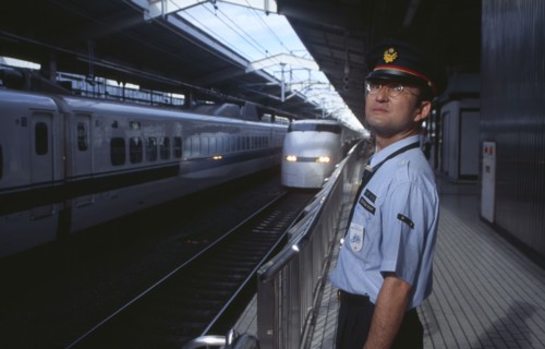 JAPAN, Honshu, Kyoto, Bullet train aka Shinkansen pulling into the station platform with train