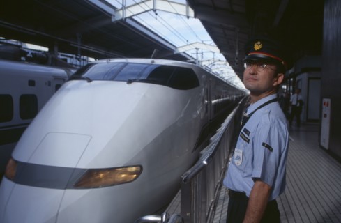 JAPAN, Honshu, Kyoto, Bullet train aka Shinkansen pulling into the station platform with train