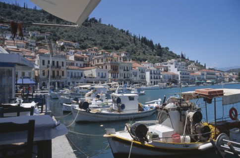 GREECE, Peloponnese, Gythio, Fishing boats moored in harbour with waterfront buildings behind.