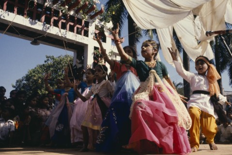 INDIA, Goa, Margao, Children dressed as adults performing dance during carnival.