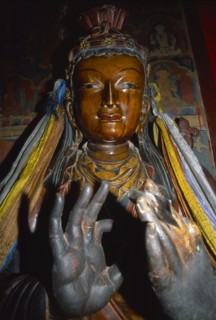 TIBET, Gyantse, Interior of the Assembly Hall with a figure of a Buddha with hands in the